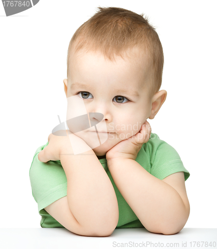 Image of Portrait of a cute and pensive little boy