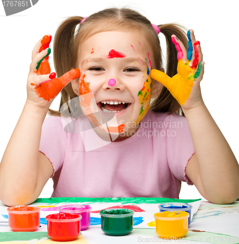Image of Cheerful girl with painted hands