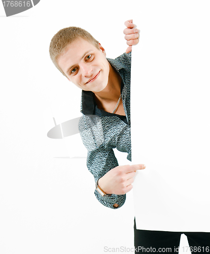 Image of A young man of a white bench