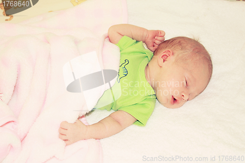 Image of Baby sleeping in bed