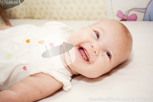 Image of the portrait of little girl in her bed