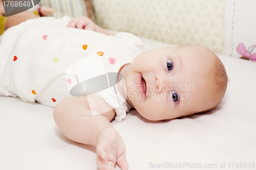 Image of the portrait of little girl in her bed