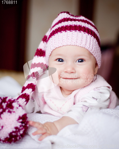 Image of pretty baby girl in striped hat