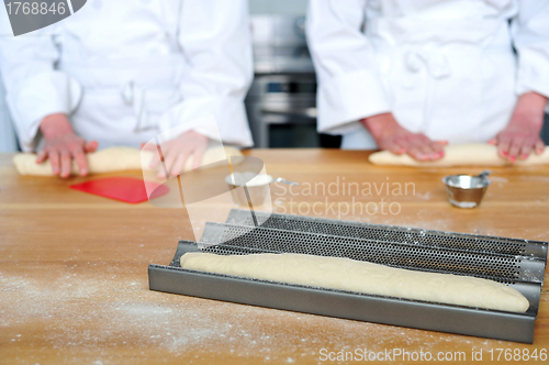 Image of Rolling the dough with hands