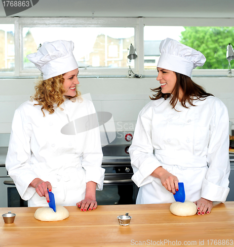 Image of Two female chefs looking at each other