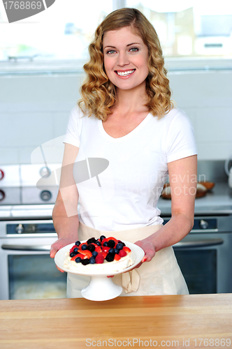 Image of Attractive female presenting yummy treat