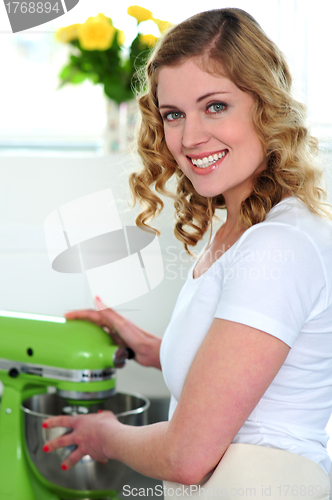 Image of Pretty female chef at work