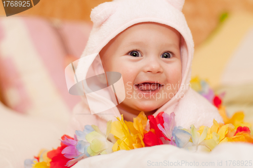 Image of smiling baby girl in pink