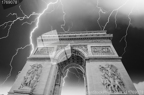 Image of Famous Arc de Triomphe in Paris with Dramatic Sky