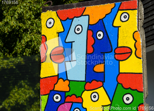 Image of Piece of Berlin Wall with colorful graffiti