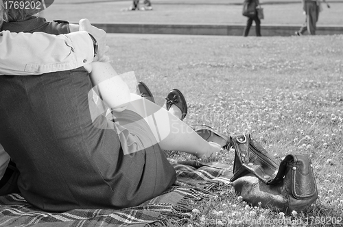 Image of Couple in the Forties relaxing on the Park