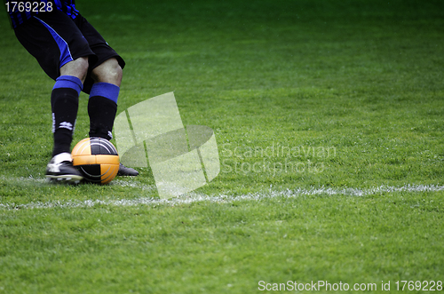 Image of Kicking the Ball during a Football Match