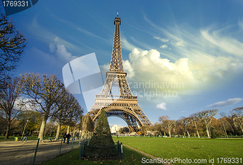 Image of Curves of the Eiffel Tower under blue sky at shiny Winter mornin