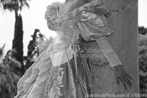 Image of Hand of a Woman on a Column