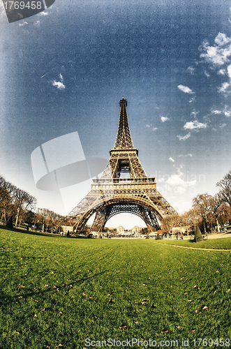 Image of Curves of the Eiffel Tower under blue sky at shiny Winter mornin