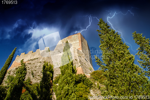 Image of Old Medieval Castle with Vegetation and Sky