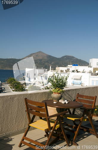 Image of view of harbor and town Adamas Milos Cyclades Greek Island Greec