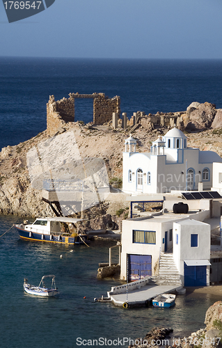 Image of houses built into rock cliffs on Mediterranean Sea Firopotamos M