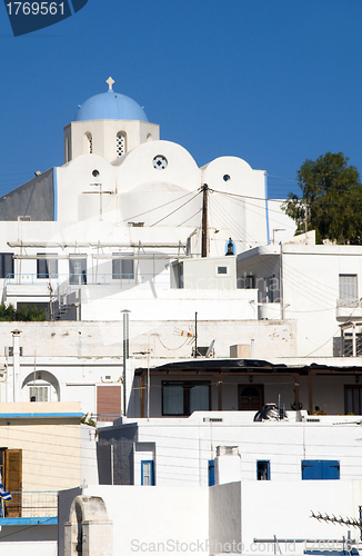 Image of  Cyclades architecture white buildings with blue shutters dome c