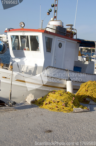 Image of traditional Greek island fishing boat with nets Milos Greece