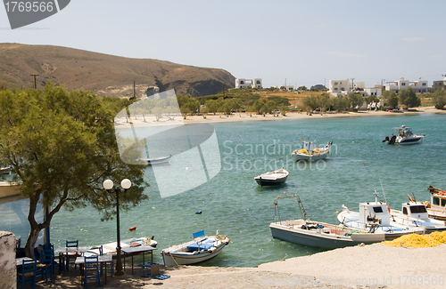 Image of harbor and beach Pollonia Milos Cyclades Greek island Greece