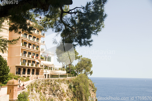 Image of luxury apartment condos built on cliff over Mediterranean Sea Mo