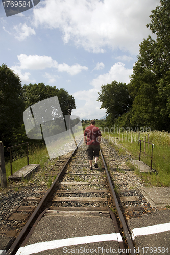 Image of Man following tracks