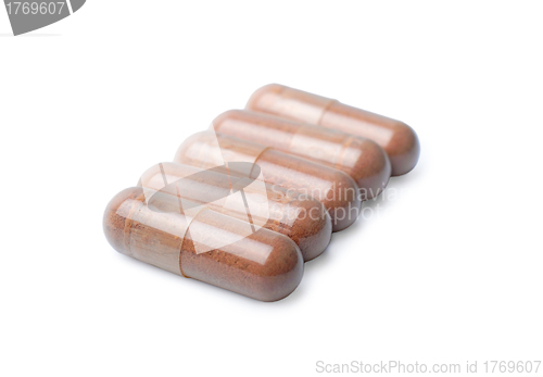 Image of Brown capsules isolated on a white background