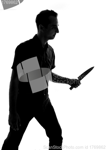 Image of silhouette of a man with knife