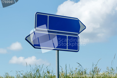 Image of sign road with blue sky 