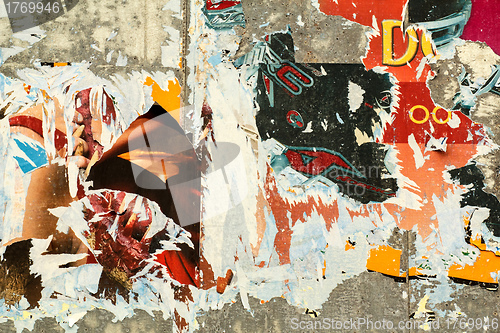 Image of grunge background with old torn posters 