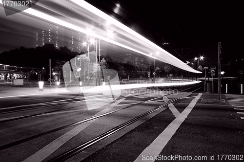 Image of Traffic through downtown of Hong Kong at night in black and whit