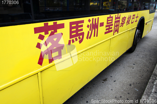 Image of Yellow bus through Hong Kong and China