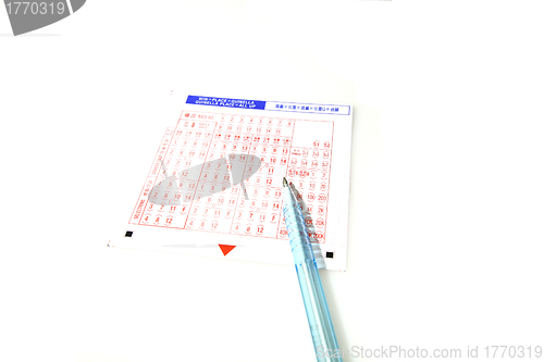 Image of Lottery with pen on white background