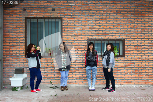 Image of Asian stylish female friends