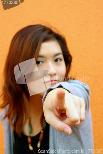 Image of Asian woman pointing