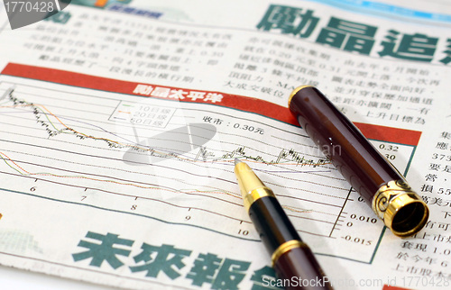 Image of Stock charts in newspaper