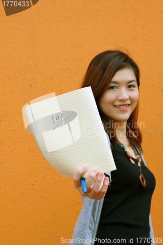 Image of Asian university student showing full marks