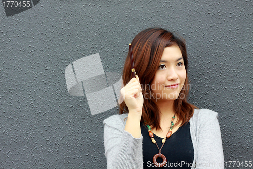 Image of Asian woman with an idea