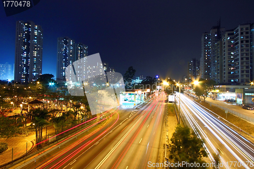 Image of Modern city and traffic at night