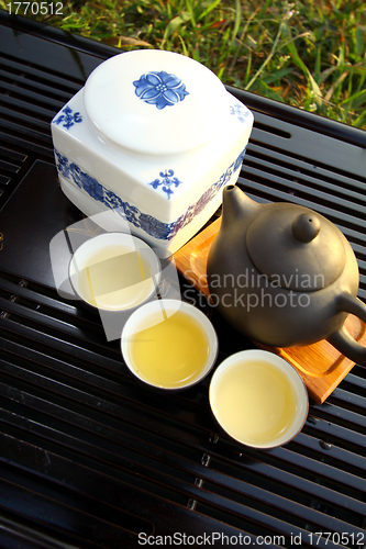 Image of Chinese tea set under sunlight