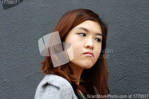 Image of Asian woman with angry face