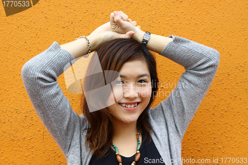 Image of Beautiful and young asian woman smiling