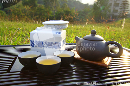 Image of Chinese tea set under sunlight