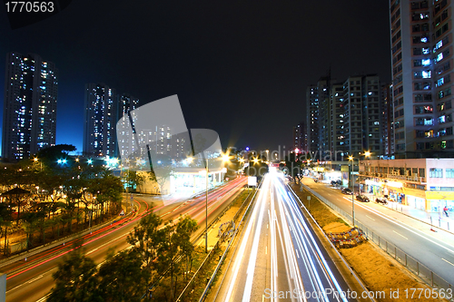 Image of Modern city and traffic at night