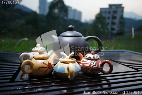 Image of Chinese tea set on grasses