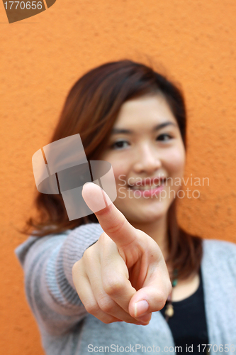 Image of Asian woman pointing 