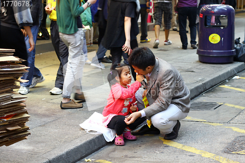 Image of Father and daugher along the street in Hong Kong 