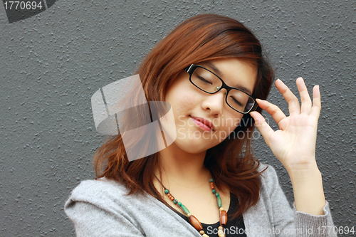 Image of Asian businesswoman with glasses