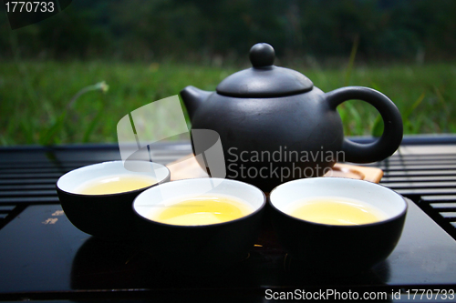 Image of Chinese tea set on grasses